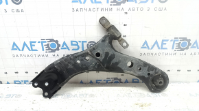 The lower front right control arm of a Toyota Sienna 21-24 has a cracked silent block.