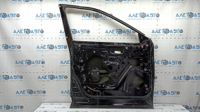 The front left door of a Nissan Rogue 21-24, black KH3, is bare, the frame is dented.
