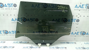 Rear left door glass for a 2014 Nissan Rogue, US built, tinted, scratches