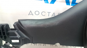 Tesla Model Y 20-25 black, worn passenger seat trim bracket, left side