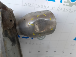 The exhaust pipe, the middle part of a Toyota Camry v40 3.5, is dented and rusty.