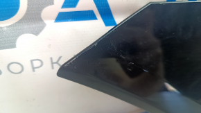 Left Audi E-Tron 19-23 charging port cover scratches