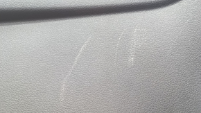 The lower trim panel of the Audi E-Tron 19-23 is black and has scratches.