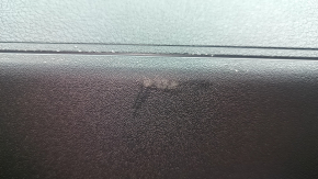 The lower trim panel of the Audi E-Tron 19-23 is black and has scratches.