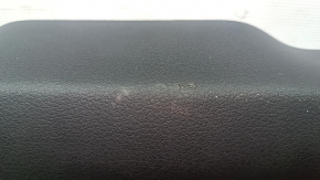 The lower trim panel of the Audi E-Tron 19-23 is black and has scratches.