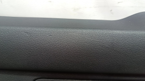 The lower trim panel of the Audi E-Tron 19-23 is black and has scratches.