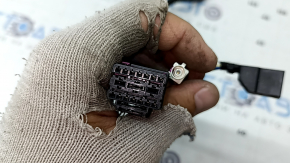 The wiring for the rear bumper of a Porsche Macan 15-25 for parking sensors and a camera is oxidized.