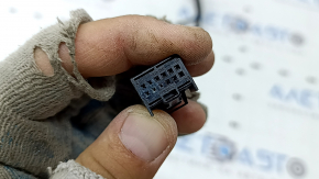 The wiring for the rear bumper of a Porsche Macan 15-25 for parking sensors and a camera is oxidized.