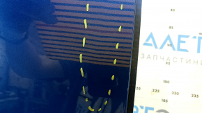 The front right door of a Porsche Macan 15-24 blue M5J is bare, with a dent.