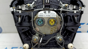 The Ford Escape MK4 20-25 driver's steering wheel airbag has scratches.