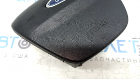 The Ford Escape MK4 20-25 driver's steering wheel airbag has scratches.