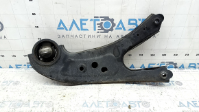 The rear left trailing arm of a Toyota Sienna 21-24 has a cracked silent block.