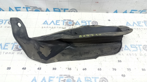 The left front bumper mudguard of a Nissan Rogue 21-24 is dented.