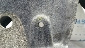 The rear left fender liner of a Toyota Sienna 21-24 is dented and torn.