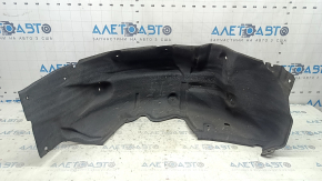 The rear left fender liner of a Toyota Sienna 21-24 is dented and torn.