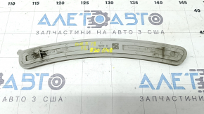 The left front bumper reflector on a BMW X5 G05 19-24 has come unglued.