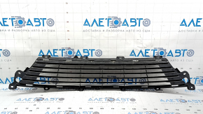The lower grille of the front bumper of a Lexus ES300h 13-15 pre-restyling is cracked.