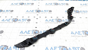 The right rear bumper mount for a Lexus ES300h ES350 13-18 has broken latches.