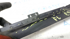 The left radiator deflector on a Ford Escape MK4 2020 hybrid is cracked.