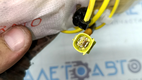 The front right seat airbag of a Toyota Prius V 12-17 has a rusty squib.
