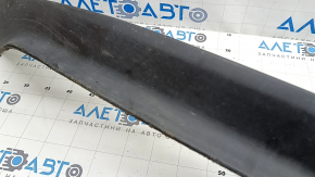 The front bumper lip of the Nissan Murano z52 15-24 is worn and scratched.