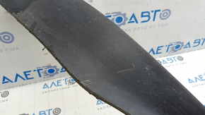 The front bumper lip of the Nissan Murano z52 15-24 is worn and scratched.