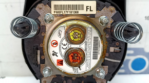The driver's side airbag in the steering wheel of a Nissan Rogue 17-20 is black and the mount is broken.