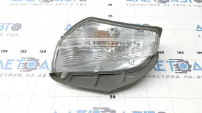 Left turn signal for a 1992 Toyota Prius V, sand, crack in the glass.