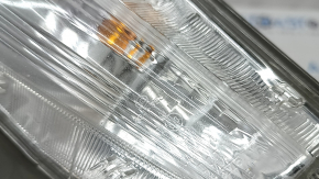 Left turn signal for a 1992 Toyota Prius V, sand, crack in the glass.