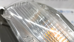 Left turn signal for a 1992 Toyota Prius V, sand, crack in the glass.