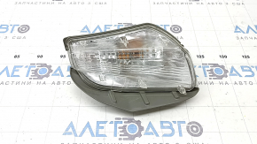 Right turn signal for a 1992 Toyota Prius V, sand, crack in the glass.