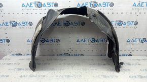The front left fender liner of a Lexus ES300h ES350 13-18 has torn fasteners.