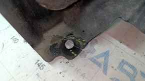 The front left fender liner of a Lexus ES300h ES350 13-18 has torn fasteners.
