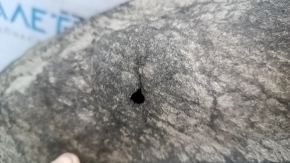 The rear left fender liner of a Ford Focus mk3 11-18 is torn and has cracks.