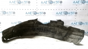 The rear left fender liner of a Ford Focus mk3 11-18 is torn and has cracks.