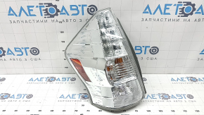Left headlight for a 2012-2014 Toyota Prius V, scratches