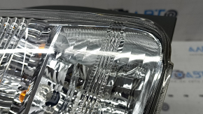 Left headlight for a 2012-2014 Toyota Prius V, scratches