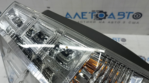 Left headlight for a 2012-2014 Toyota Prius V, scratches