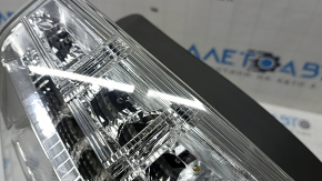 Left headlight for a 2012-2014 Toyota Prius V, scratches