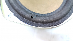 The left rear shelf speaker of a Lincoln MKZ 13-16 is torn.