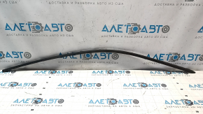 Upper front right door molding for a 1993 Chevrolet Camaro, black, with some wear.