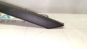 Upper front right door molding for a 1993 Chevrolet Camaro, black, with some wear.