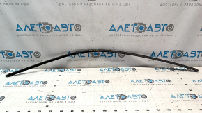 Upper front right door molding for a 1993 Chevrolet Camaro, black, with some wear.