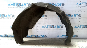 The rear left fender liner of a Ford Mustang mk6 15-23 has a torn seam.