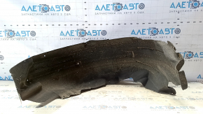 The rear left fender liner of a Ford Mustang mk6 15-23 has a torn seam.