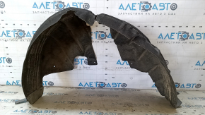 The rear left fender liner of a VW Beetle 12-19 is torn, the fastener is torn, the seam is torn, a fragment is missing