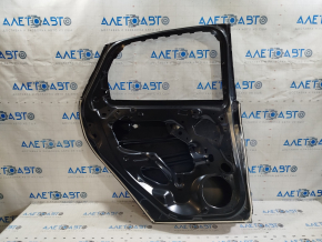 The rear left door of a Ford Focus mk3 11-18 (China) is bare and has a dented corner.