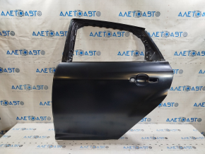 The rear left door of a Ford Focus mk3 11-18 (China) is bare and has a dented corner.