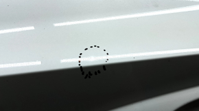 The bare rear left door of a Hyundai Tucson 22-24 white TW3, dents