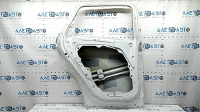 The bare rear left door of a Hyundai Tucson 22-24 white TW3, dents